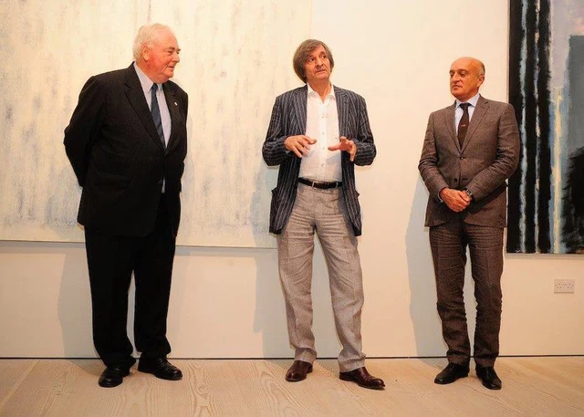 Farhad Khalilov speaking with guests at the 2011 opening of Acquaintance in London.