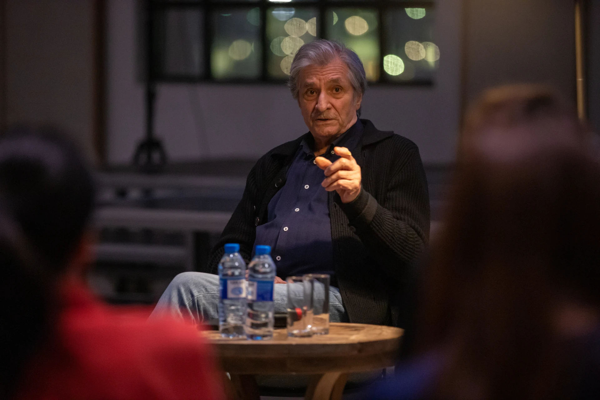Farhad Khalilov pointing towards a participant during the conversation with Sabina Shikhlinskaya's course.