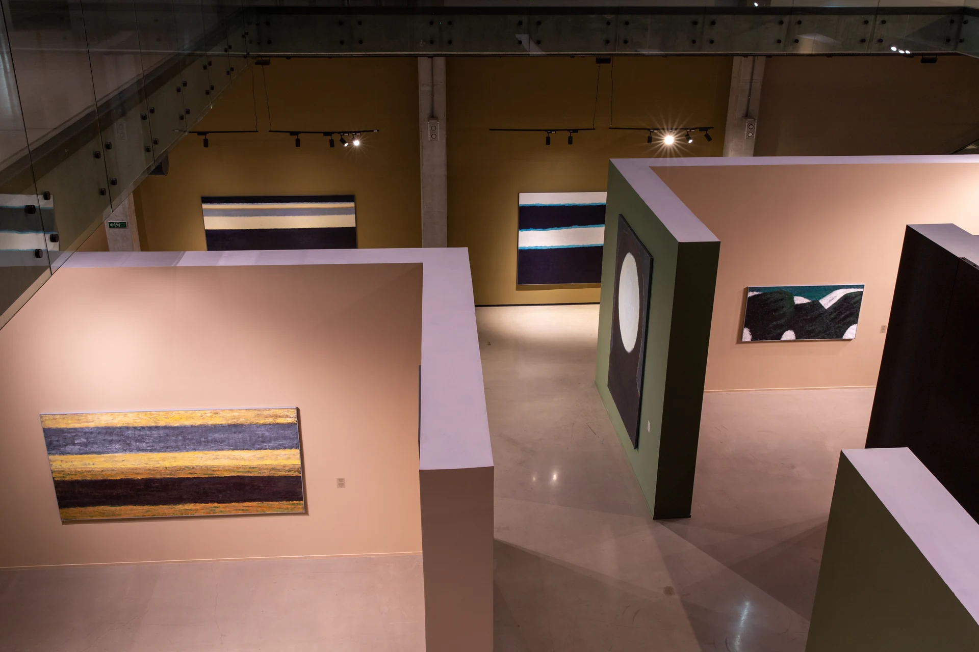 View from the museum's upper level across the exhibition's freestanding walls and open galleries.