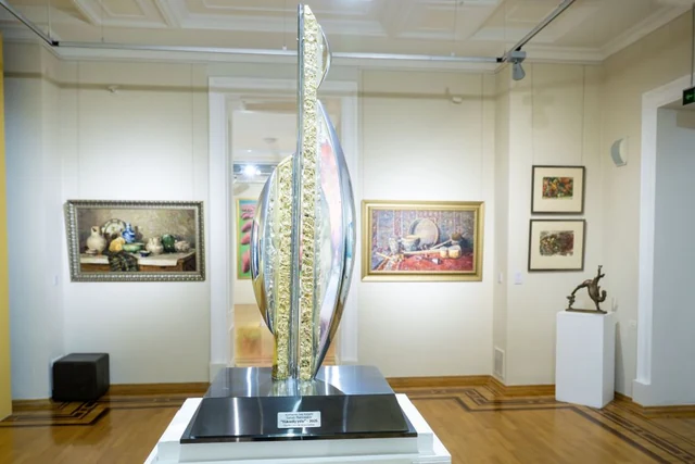 Wide view of paintings and sculpture in Azerbaijani Visual Art: From Classicism to Postmodernism at the Azerbaijan National Museum of Art.
