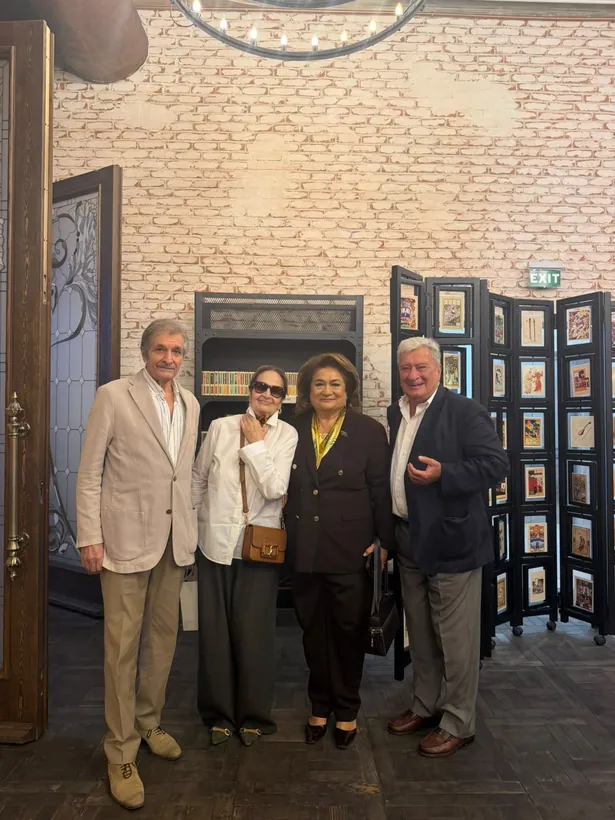 With guests at an exhibition