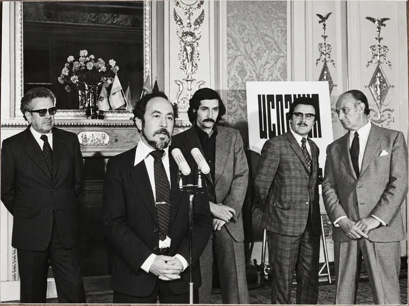 With colleagues at a formal gathering
