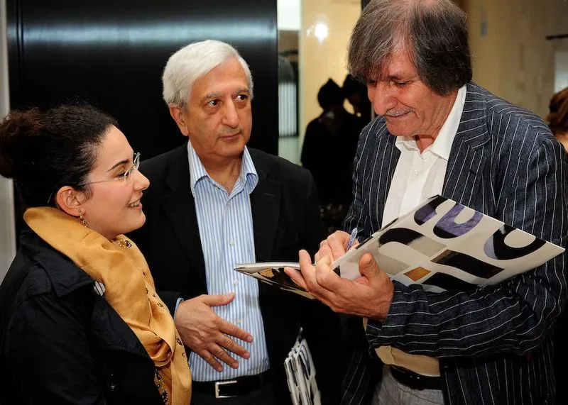 Meeting visitors at an exhibition, 2011