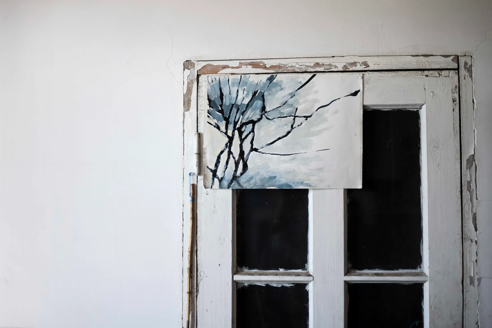 A painting and the studio window. Photograph by Maya Baghirova.